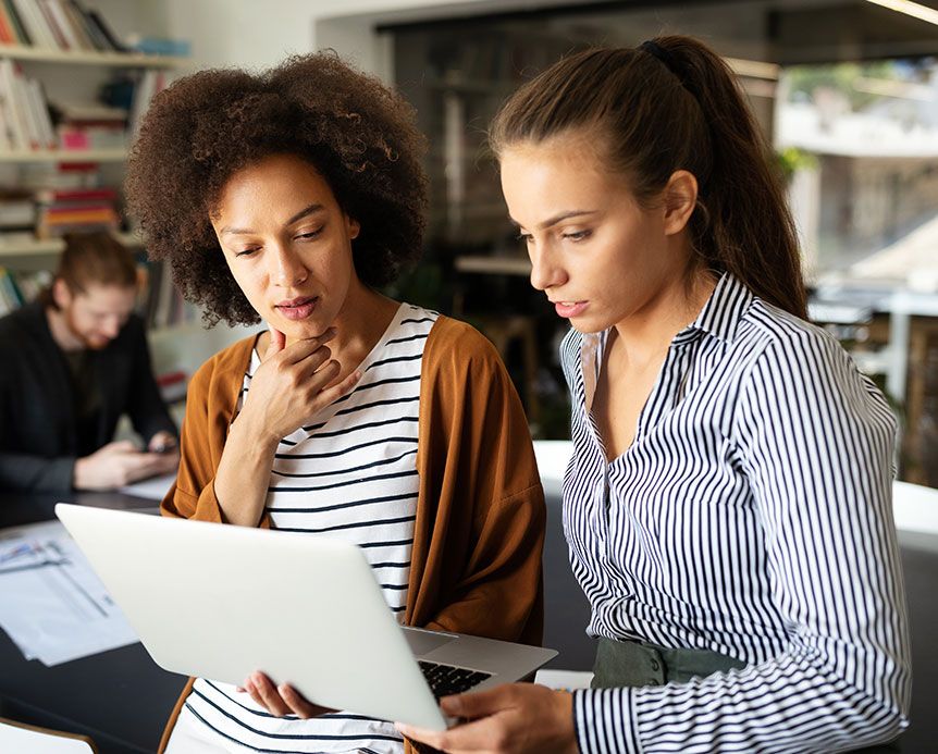 Two women collaborating on root cause with Causelink software